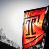 The cherry red Temple T flag on a sunny day 